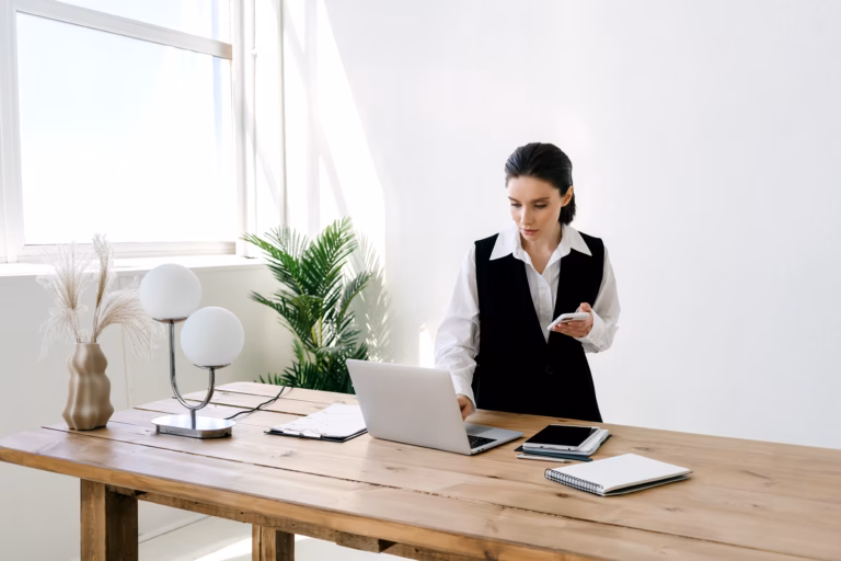 Senior executive looking away from a computer screen in an office setting