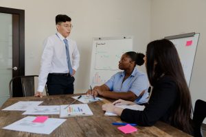 professional woman leading business meeting with colleagues