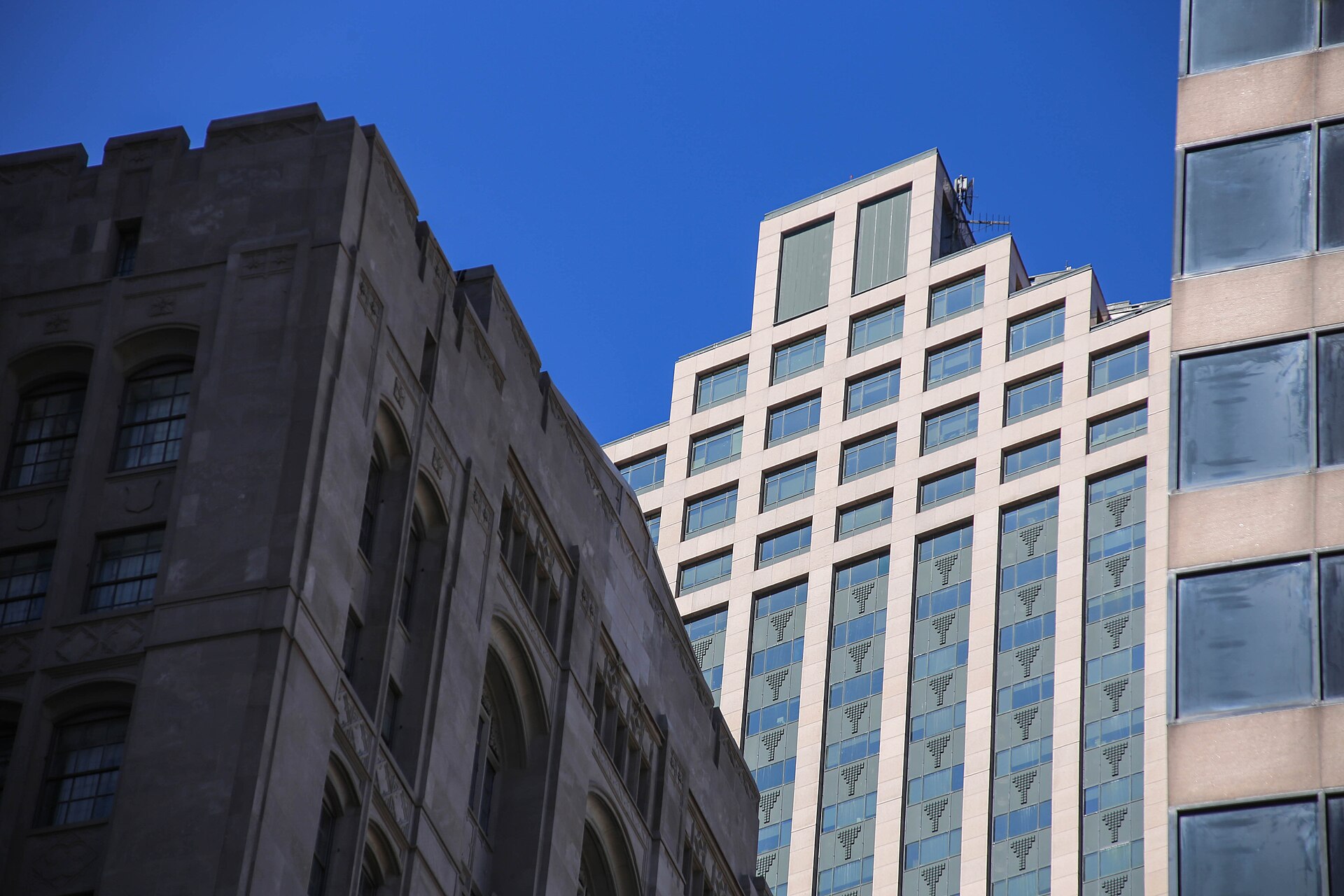 Office buildings in New Orleans beneath a clear blue sky