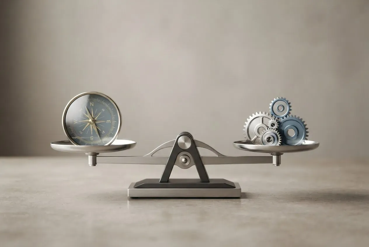 Balanced scale holding a compass and interlocking gears, symbolizing harmony between strategy and operational execution.
