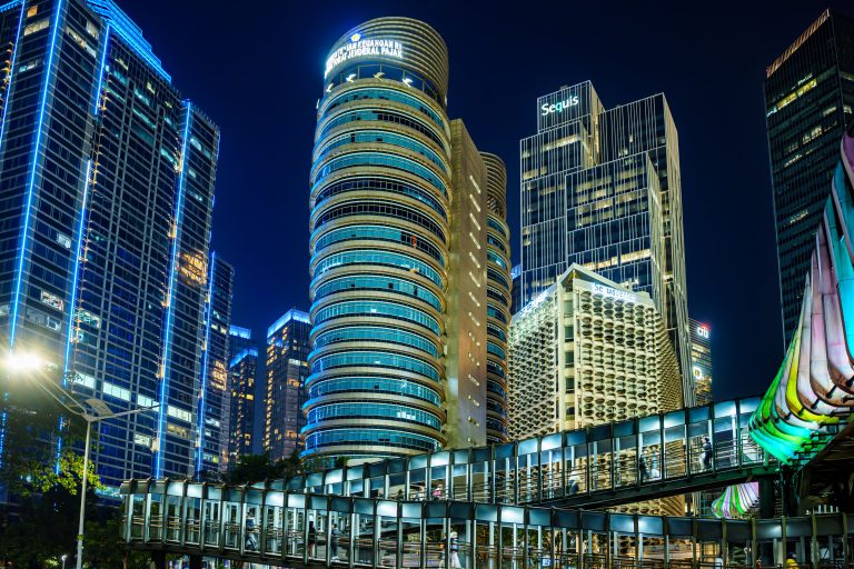 Vibrant skyline of Jakarta's Central Business District at night showcasing modern skyscrapers