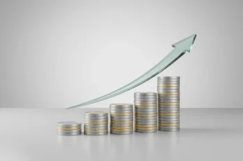 Stepped coin stacks with a glass upward arrow on a soft gray background, symbolizing startup fundraising and growth.