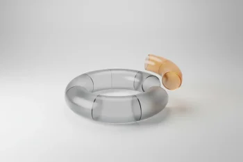 Translucent glass donut chart with one lifted, glowing amber segment on a soft gray background, symbolizing employee satisfaction insight.